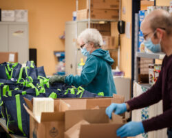Lady-and-Man-packing-food-into-Bags