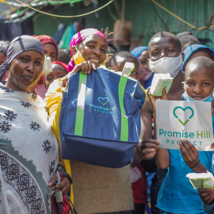 Slum-12.great-smiles-show-gratitude-and-excellent-brand-placement-for-Promise-Hill